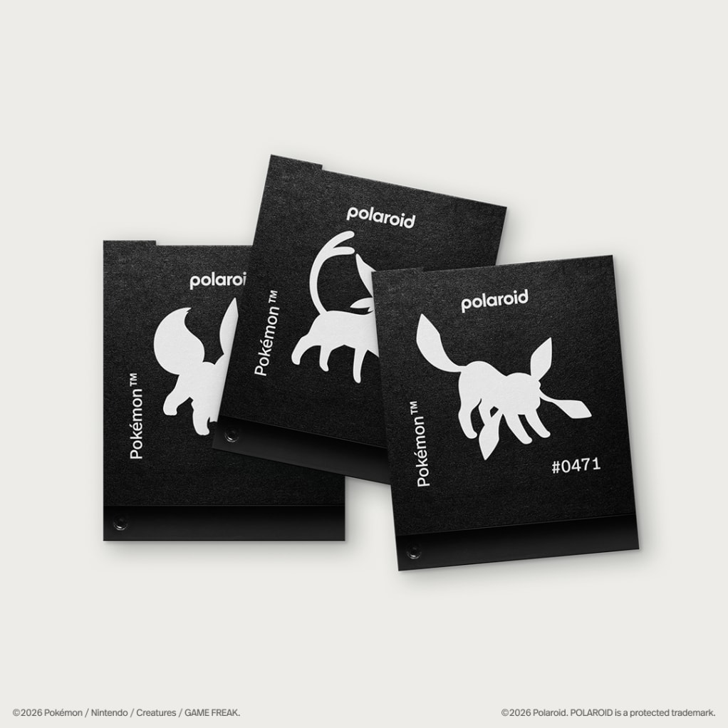 Polaroid x Pokémon film packs, camera case, photo album, and camera strap accessories laid out together